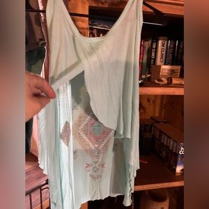 Super adorable sway tank with open back… one of a kind as well